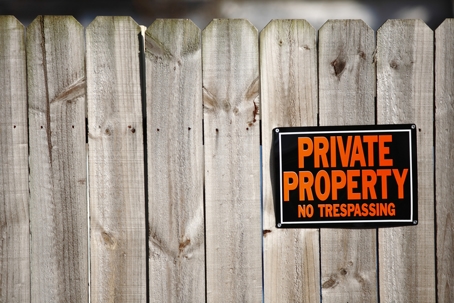 No trespassing sign on fence